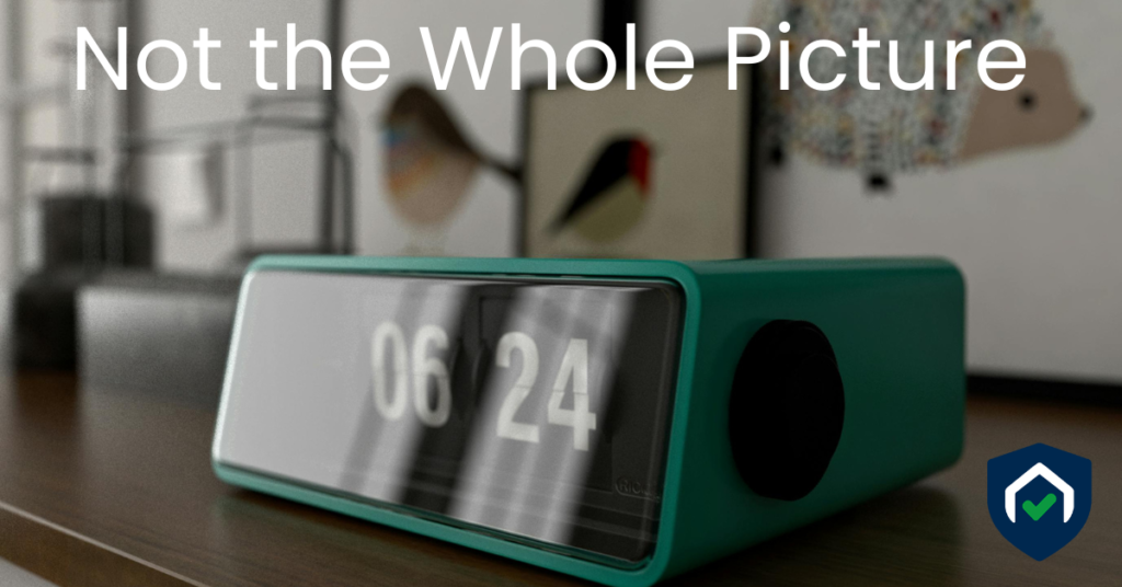 Framed family photos on a shelf with personal belongings visible in the background, illustrating incidental documentation